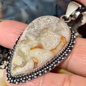 “The Laughter Stone” Crazy Lace Laguna Pendant 2 1/4”